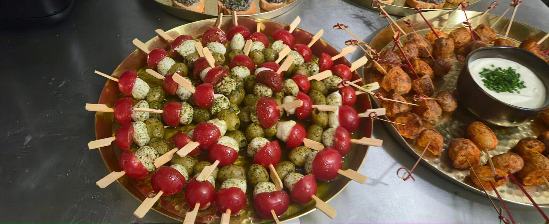 Caprese skewers with cherry tomato, mozzarella and pesto