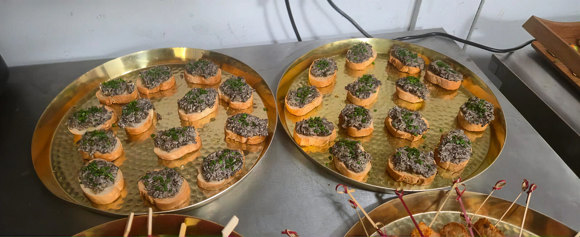 Mushroom pâté bruschetta on hammered gold trays